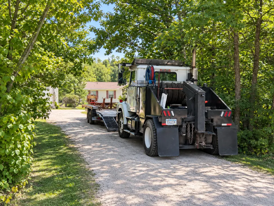 Northwoods equipment on a wooded access driveway